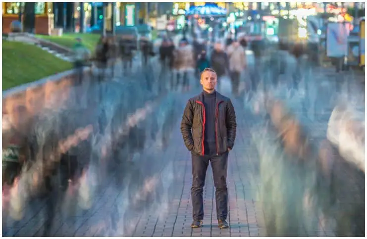 man alone in crowd rainning