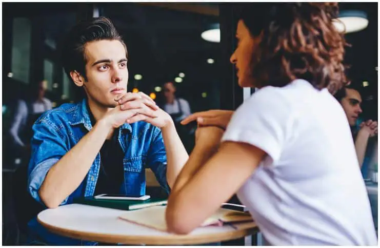 man attentively listening a woman