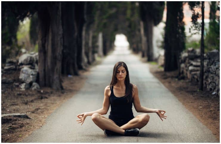 woman in meditation in wood