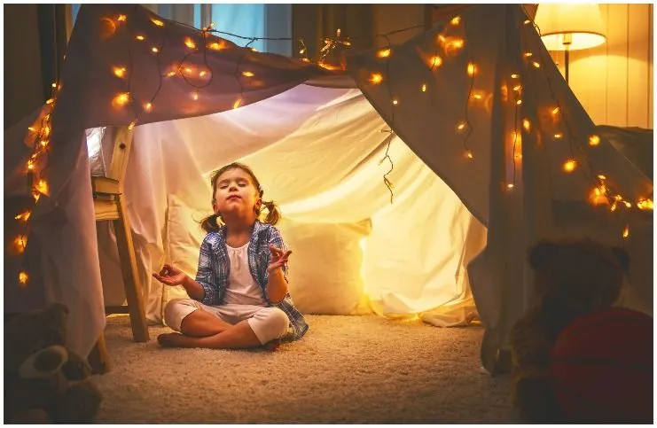 child meditation in a tent