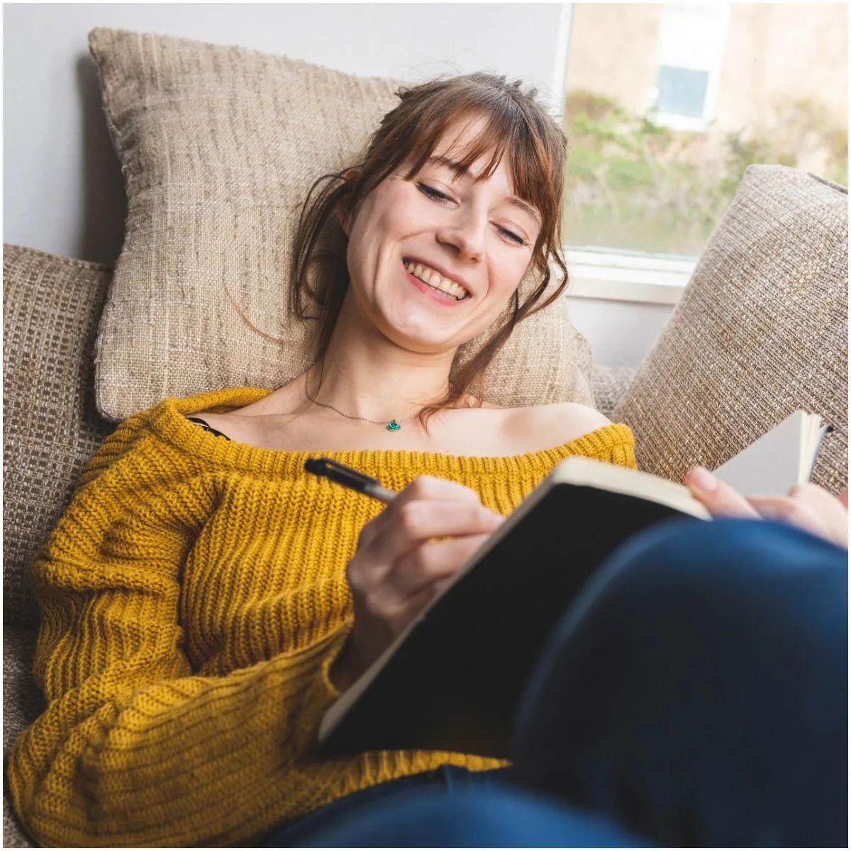 woman writting in a journal